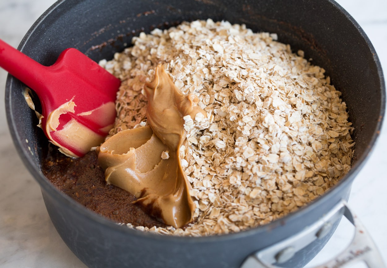 no bake cookies mixing in oats peanut butter and vanilla