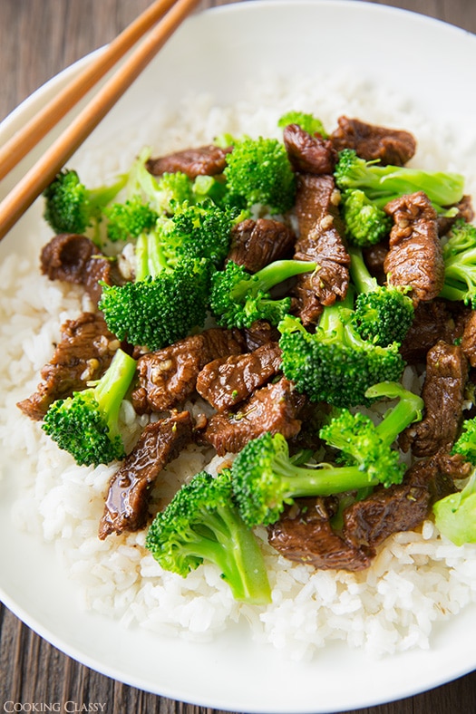 Slow Cooker Beef and Broccoli with white rice and chopsticks