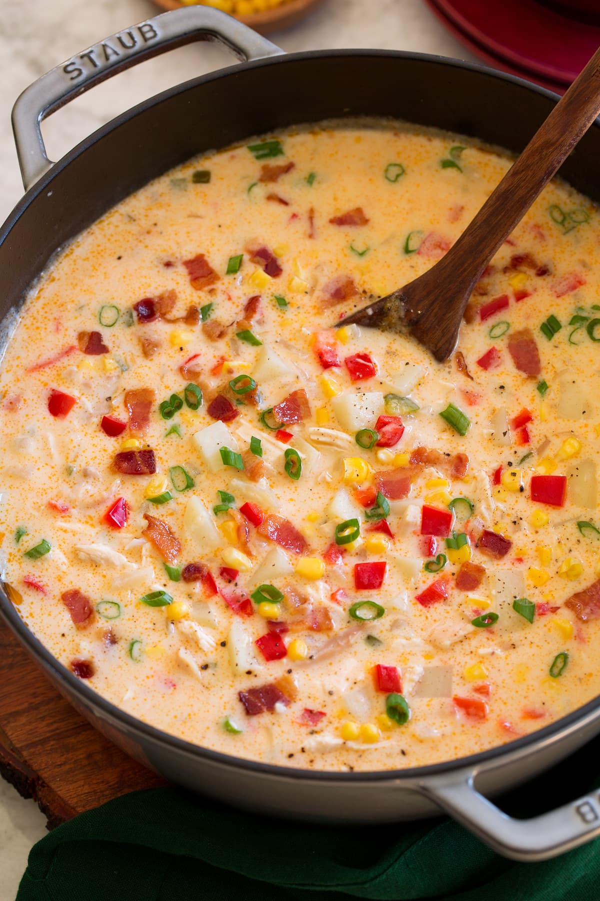 Close up photo of creamy chicken corn chowder in a pot.