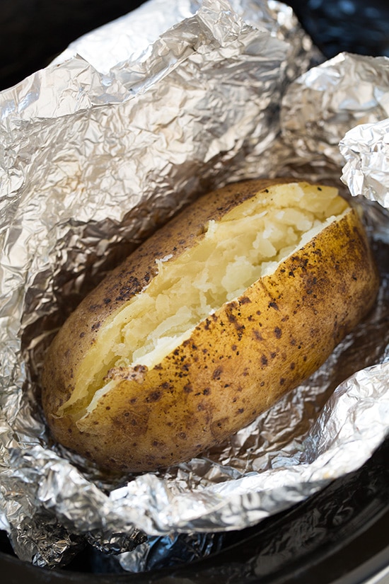 Slow cooker potato cut open, shown after cooking.