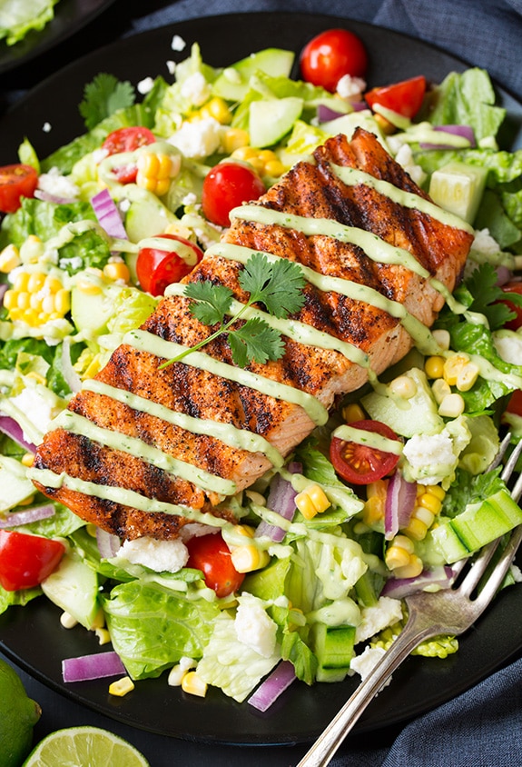 Mexican Grilled Salmon Salad in dark bowl with fork