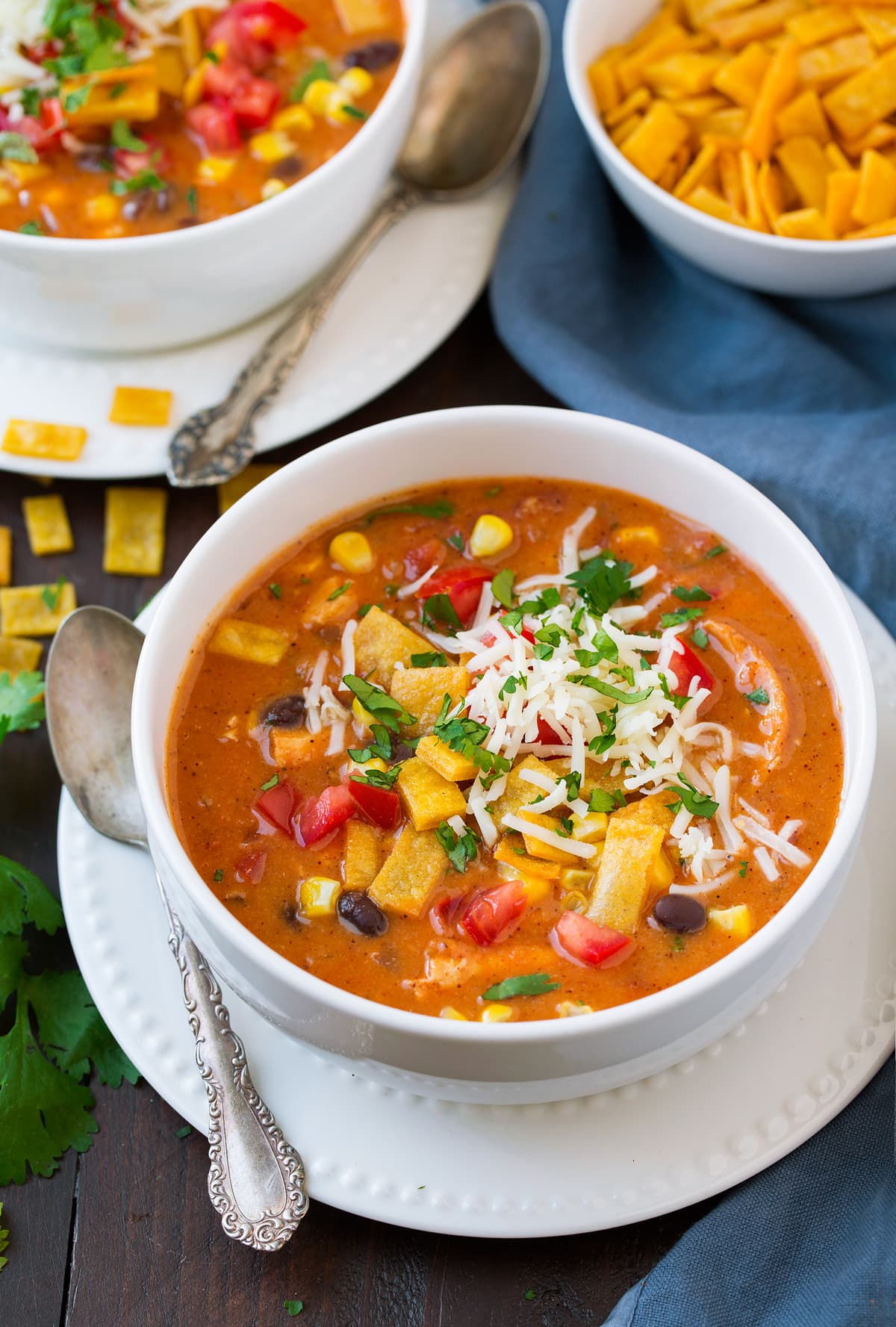 Single serving of cheesy chicken enchilada soup in a bowl.