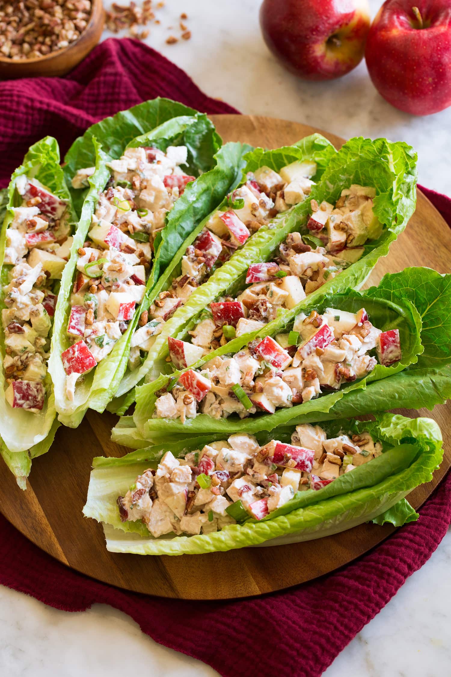 Apple chicken salad served in lettuce leaf boats.