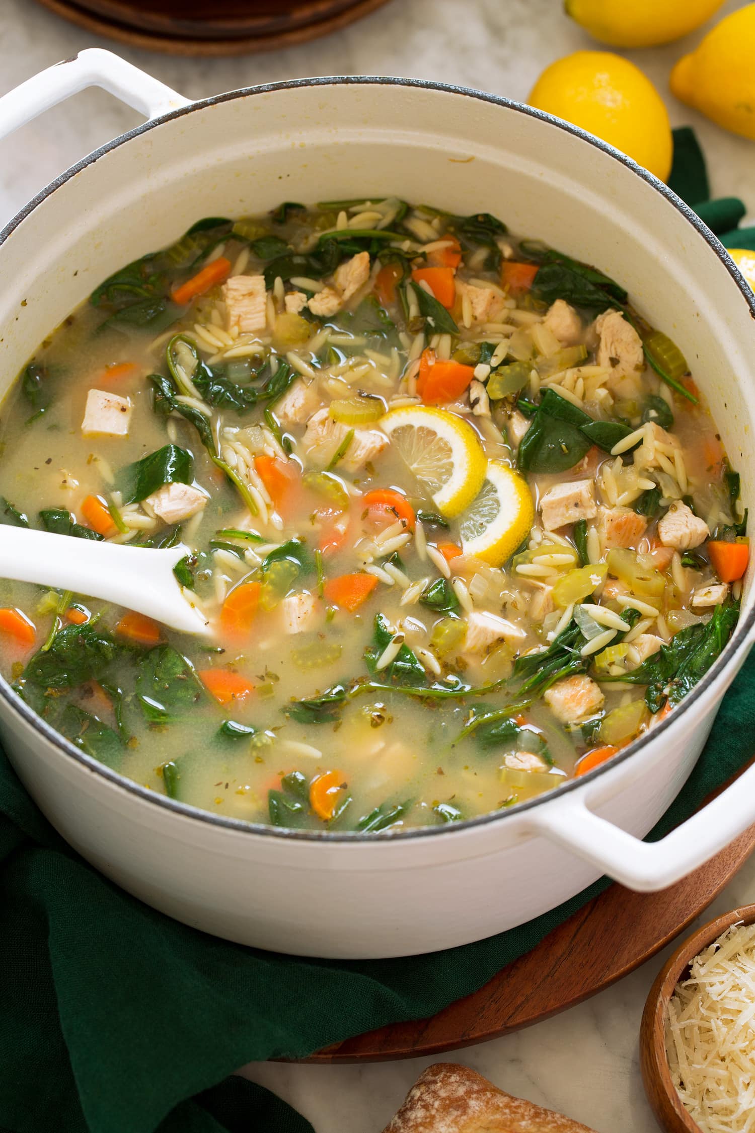 Pot full of chicken lemon orzo soup.