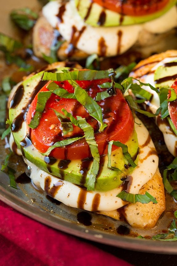 Caprese Chicken Breasts topped with mozzarella, avocado, tomato and fresh basil