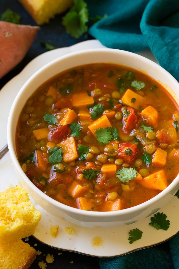 Sweet potato soup with lentils in a serving white bowl.