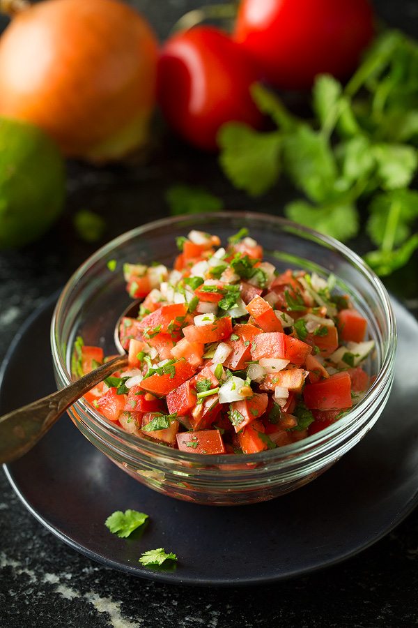 Pico de gallo in a small glass bowl for tostadas