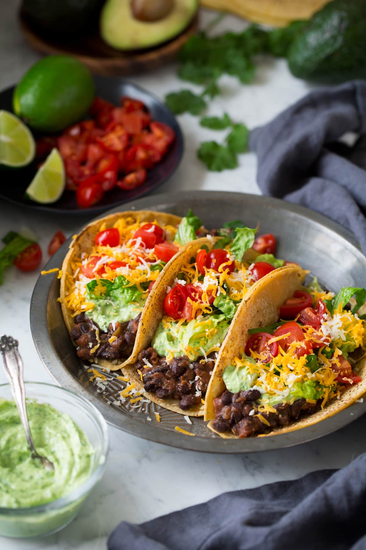 Three black bean tacos in a pie dish