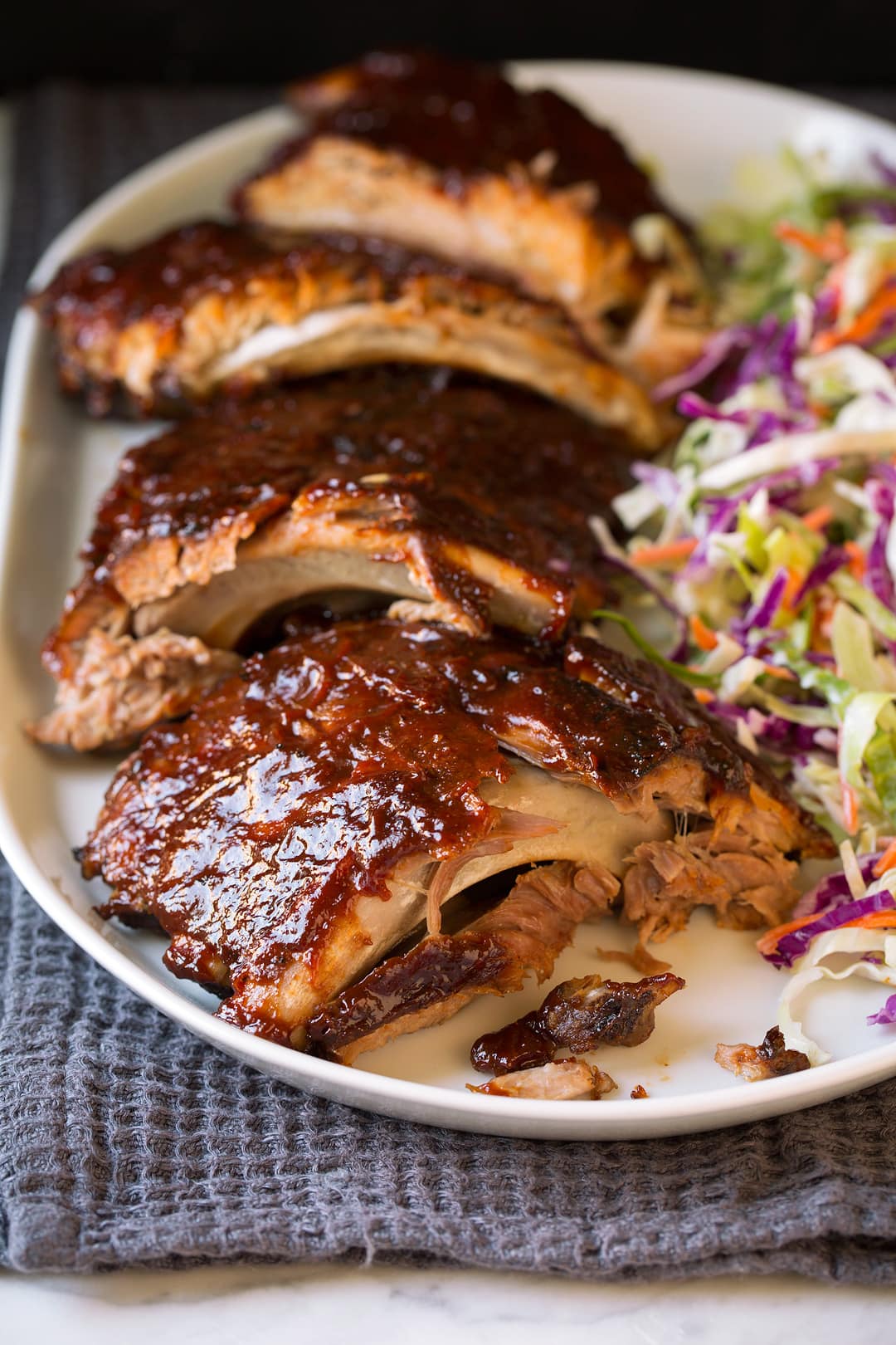 Slow Cooker Ribs with coleslaw on white plate