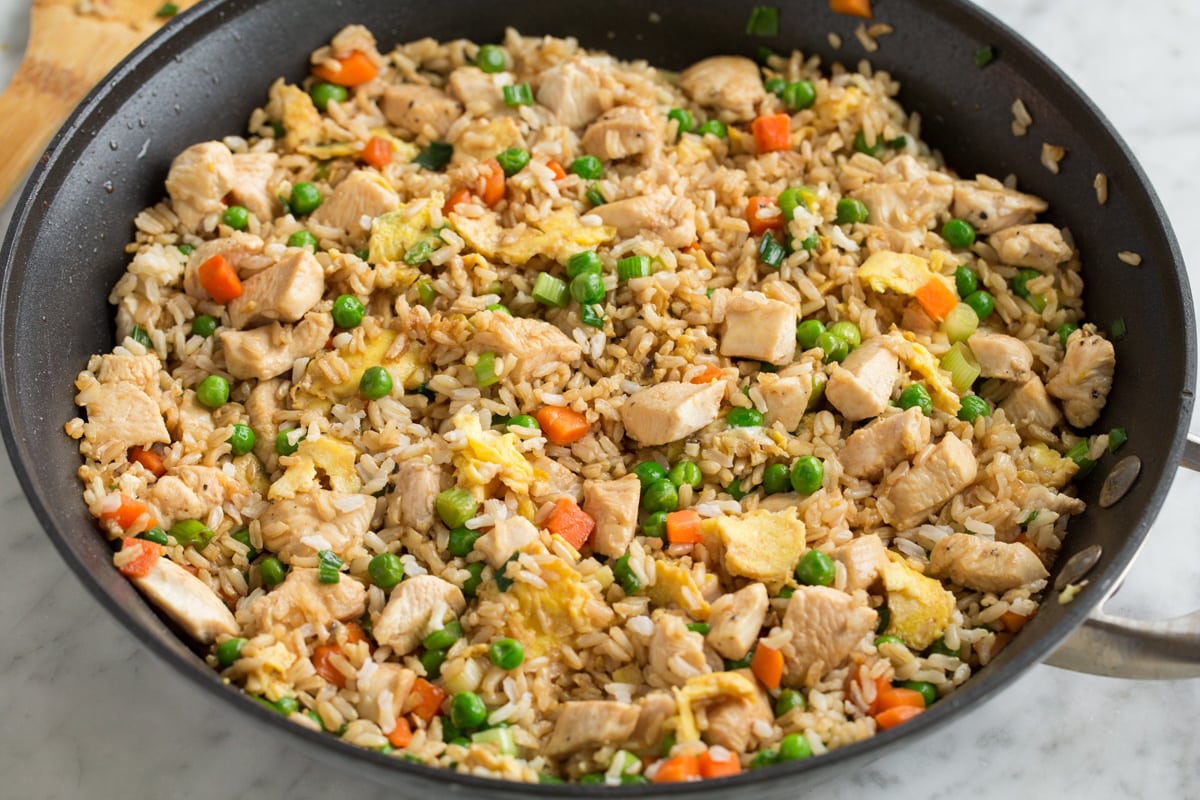 Completed chinese chicken fried rice all tossed together in a large skillet.