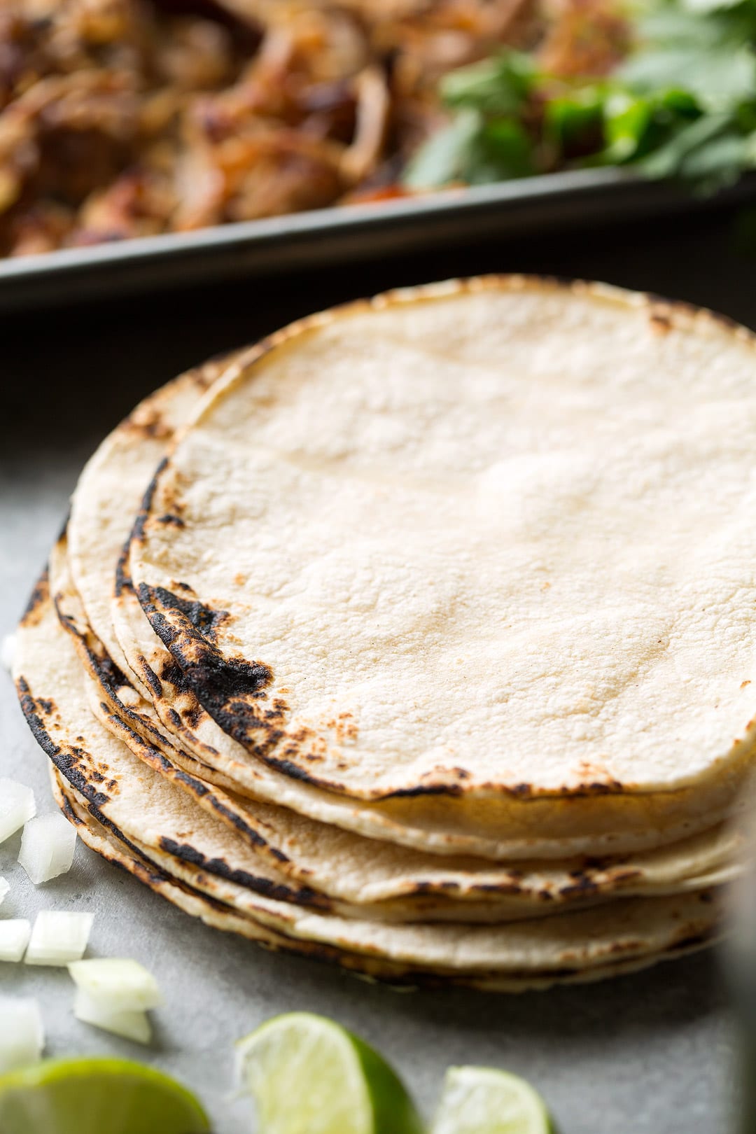 Carnitas shown here are the charred corn tortillas for serving carnitas on 