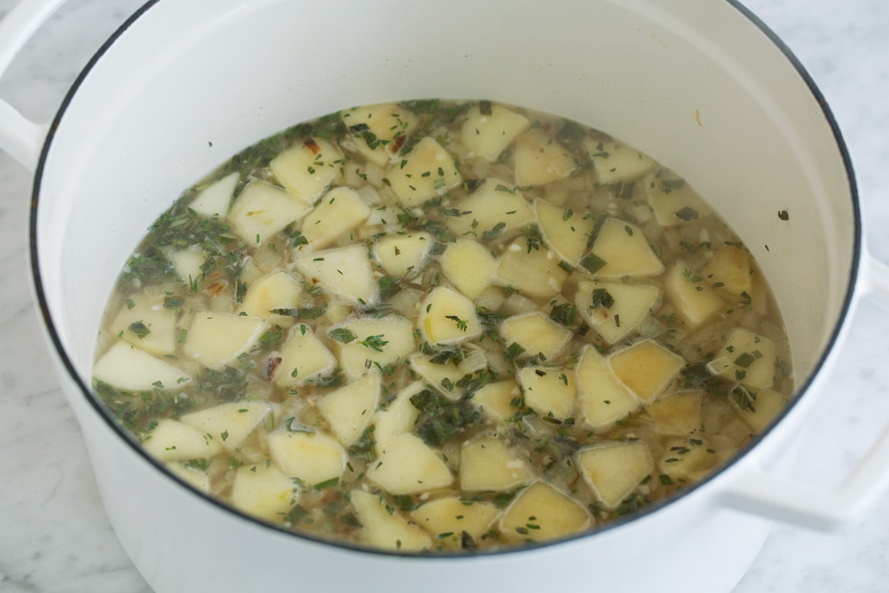 Shown here adding chicken broth to soup mixture for butternut squash soup