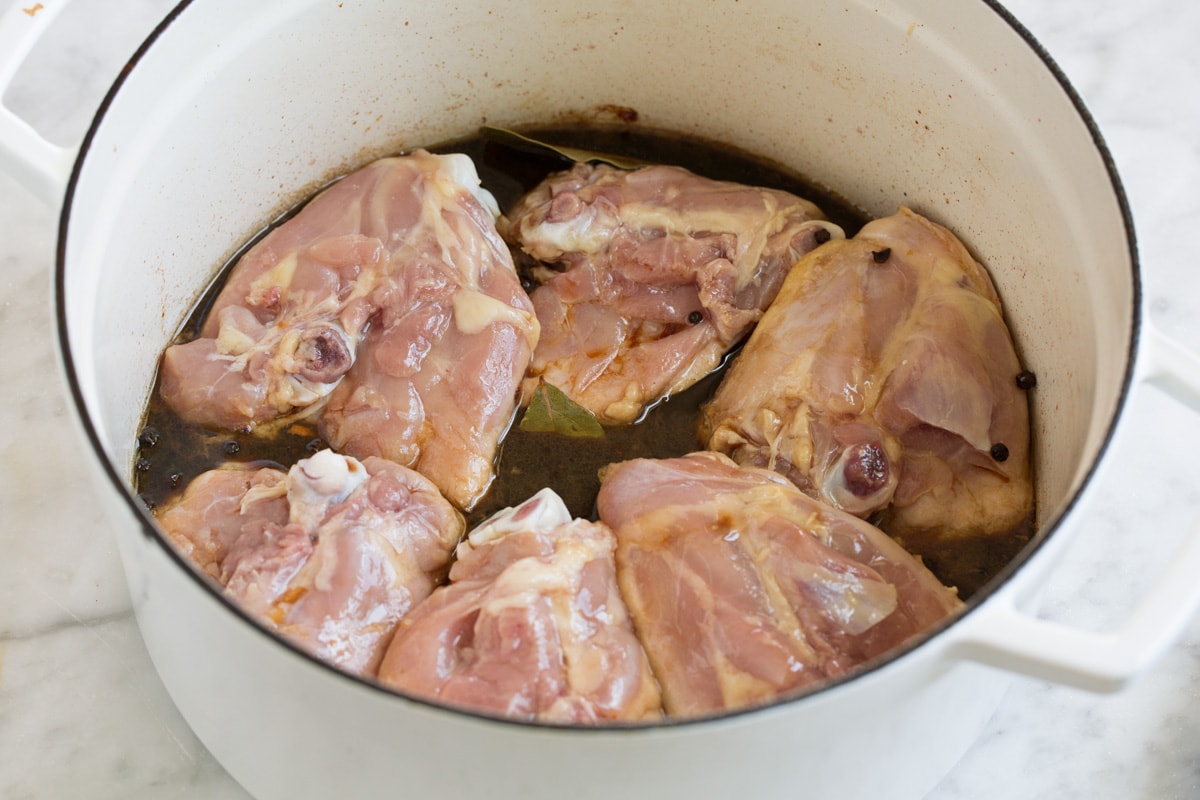 Six chicken thighs in adobo sauce before cooked.