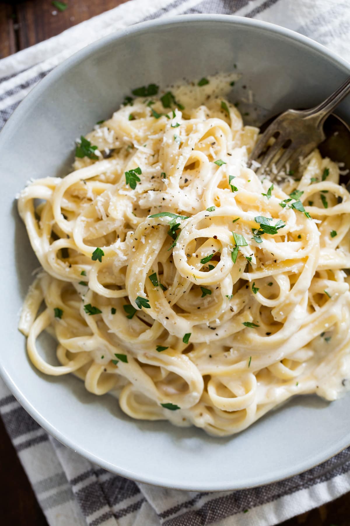 Overhead image of single serving of homemade fettuccine alfredo.