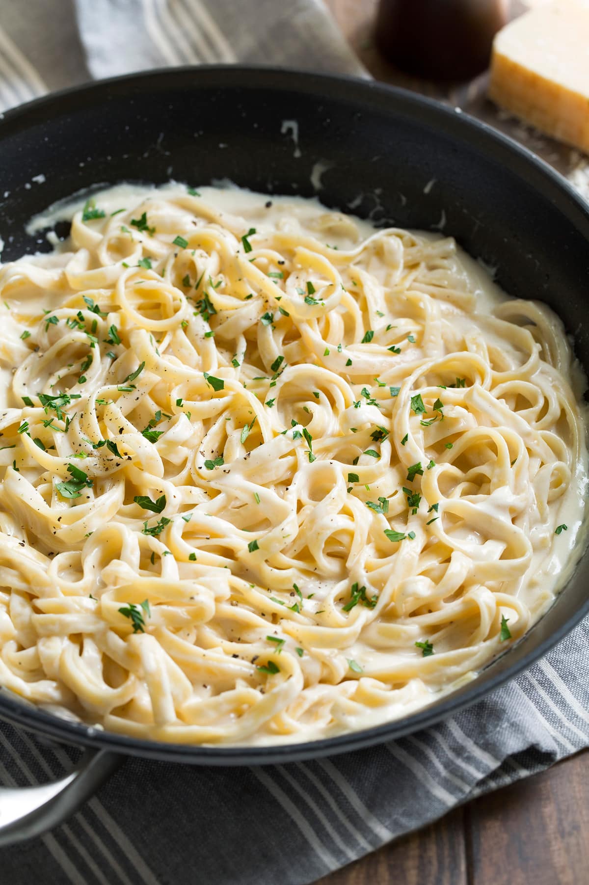 Fettuccine alfredo in a large pan.