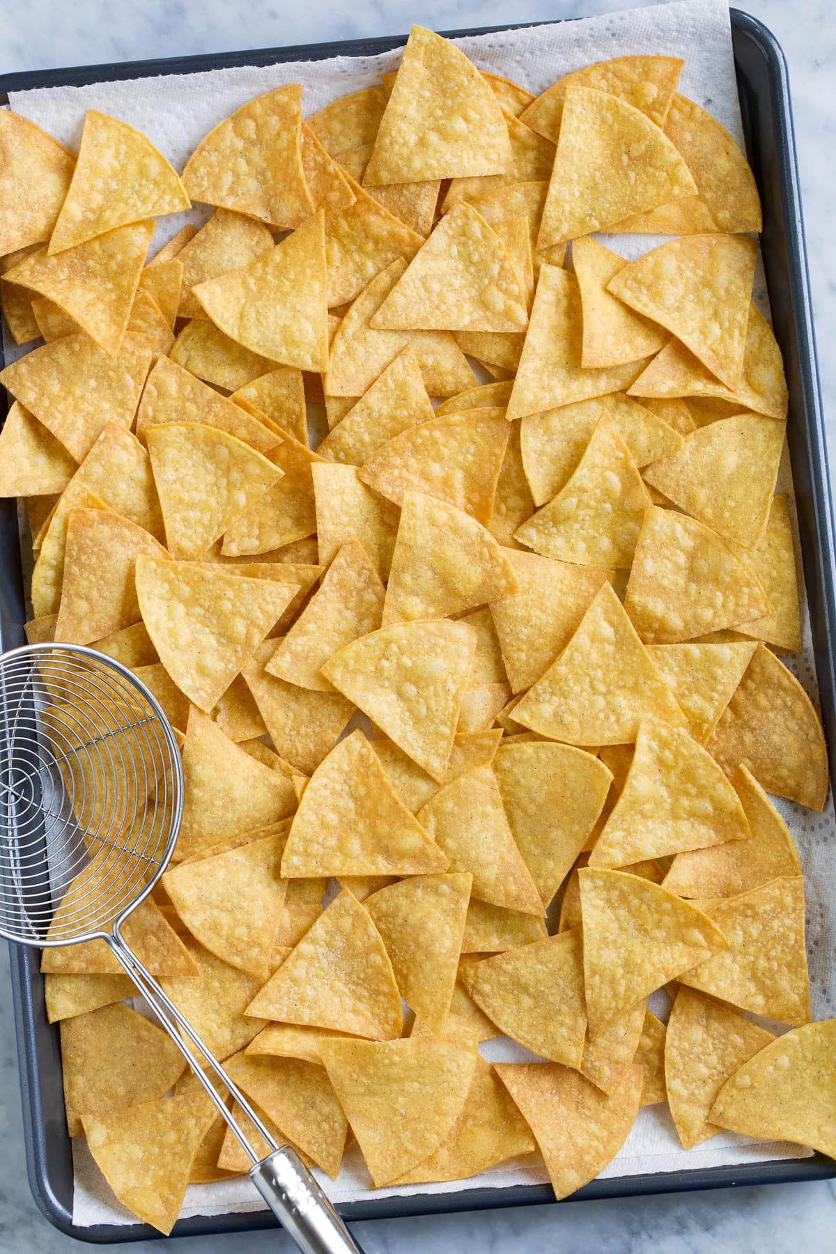 Pan full of homemade tortilla chips.