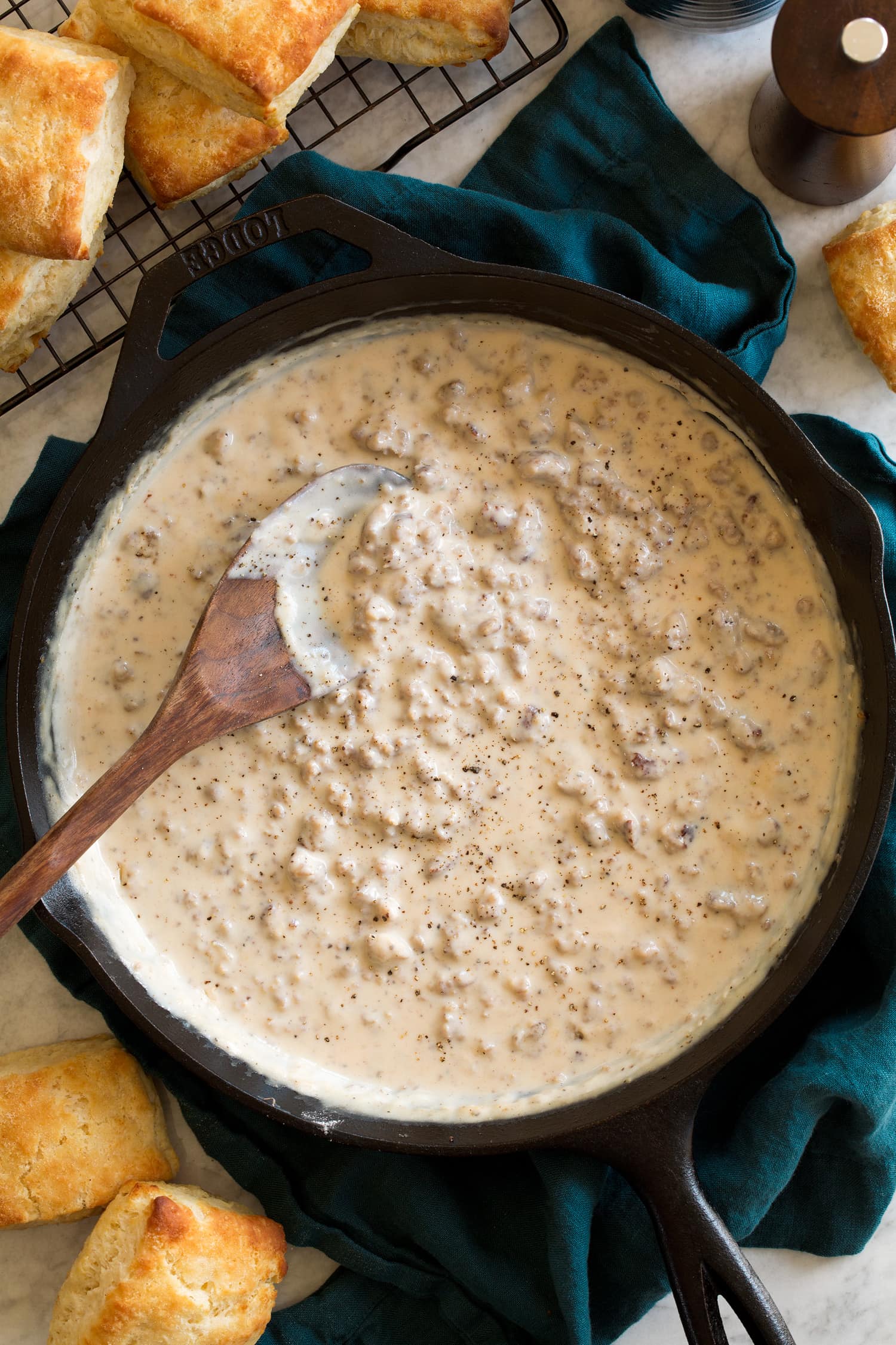 Sausage gravy in a cast iron skillet shown from above.