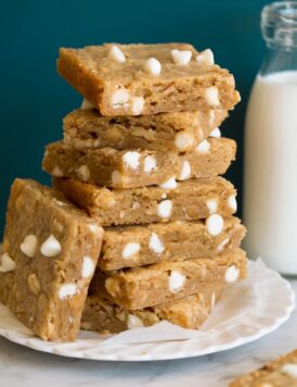 Stack of blondies with white chocolate chips.