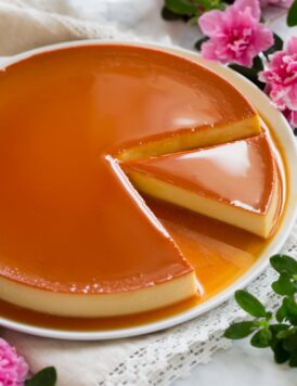 Image of flan with a slice cut.