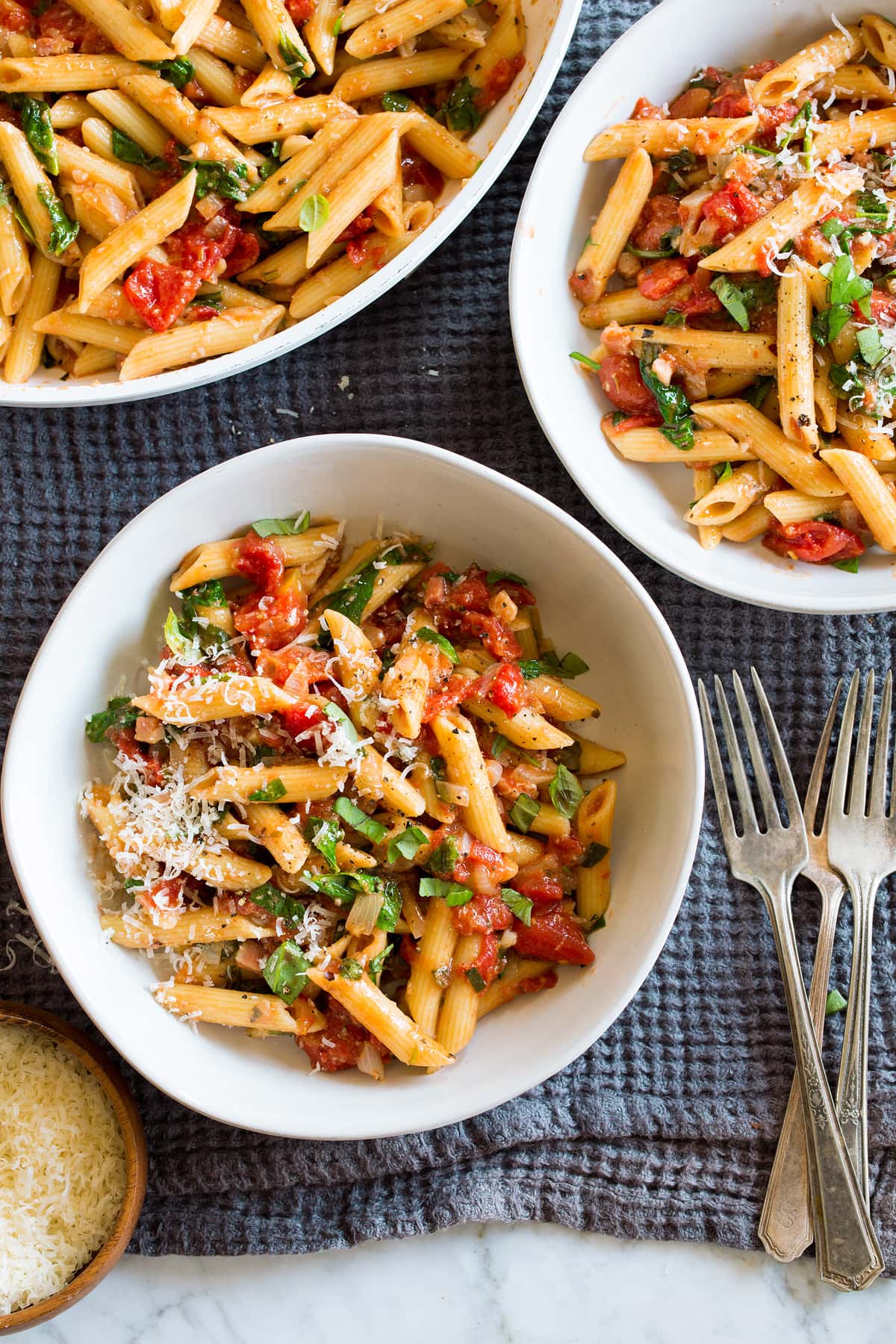 One Pot Tomato Basil Pasta shown in individual serving bowls.