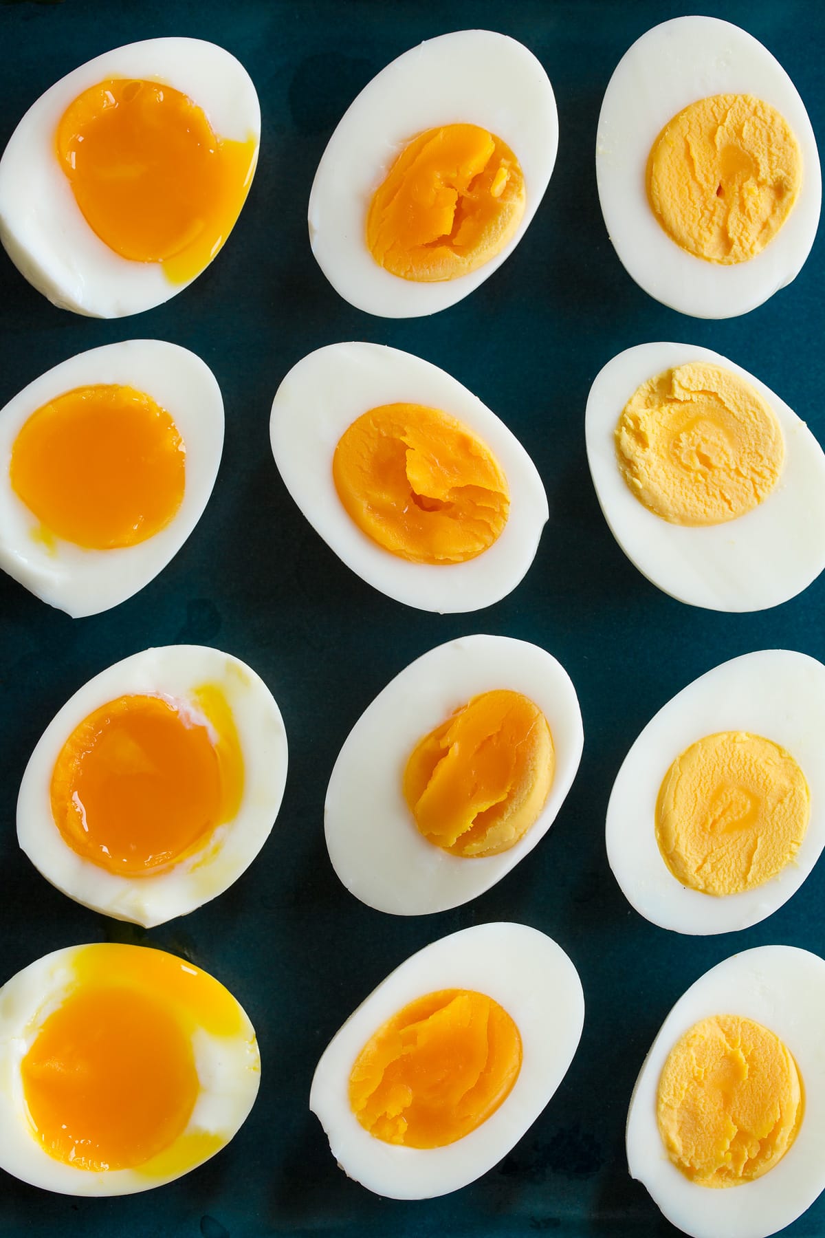 Overhead photo showing three types of steamed eggs with set yolk, nearly set yolk and runny yolk.