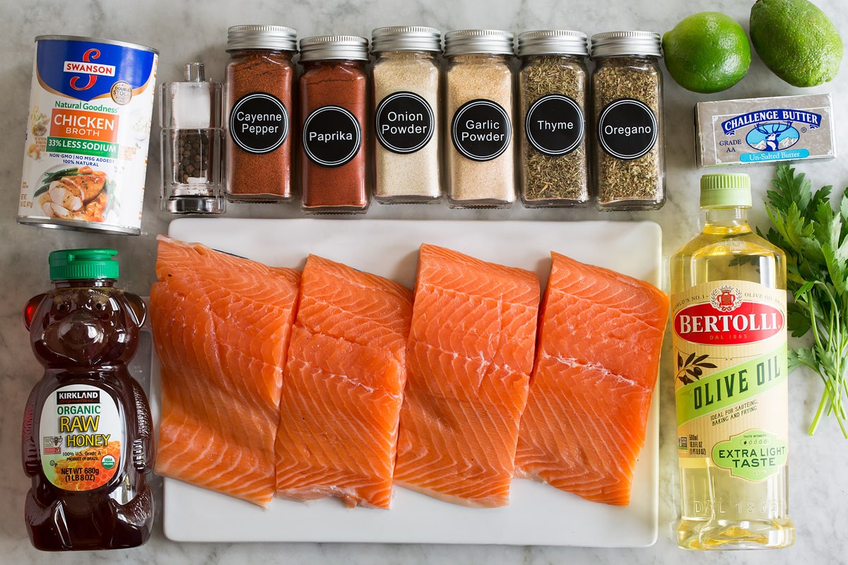 Image of ingredients used to make blackened salmon shown overhead on a marble surface.