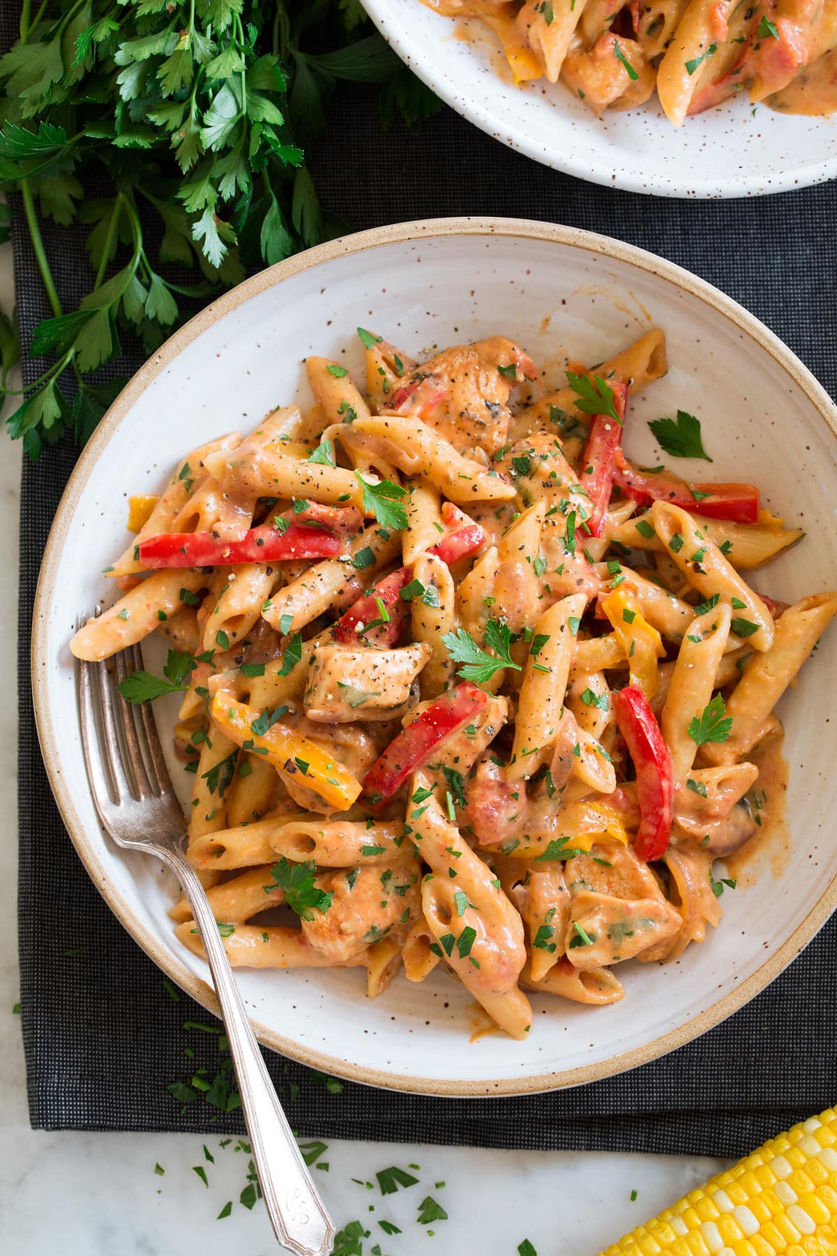 Photo: Serving of cajun chicken pasta in a bowl.