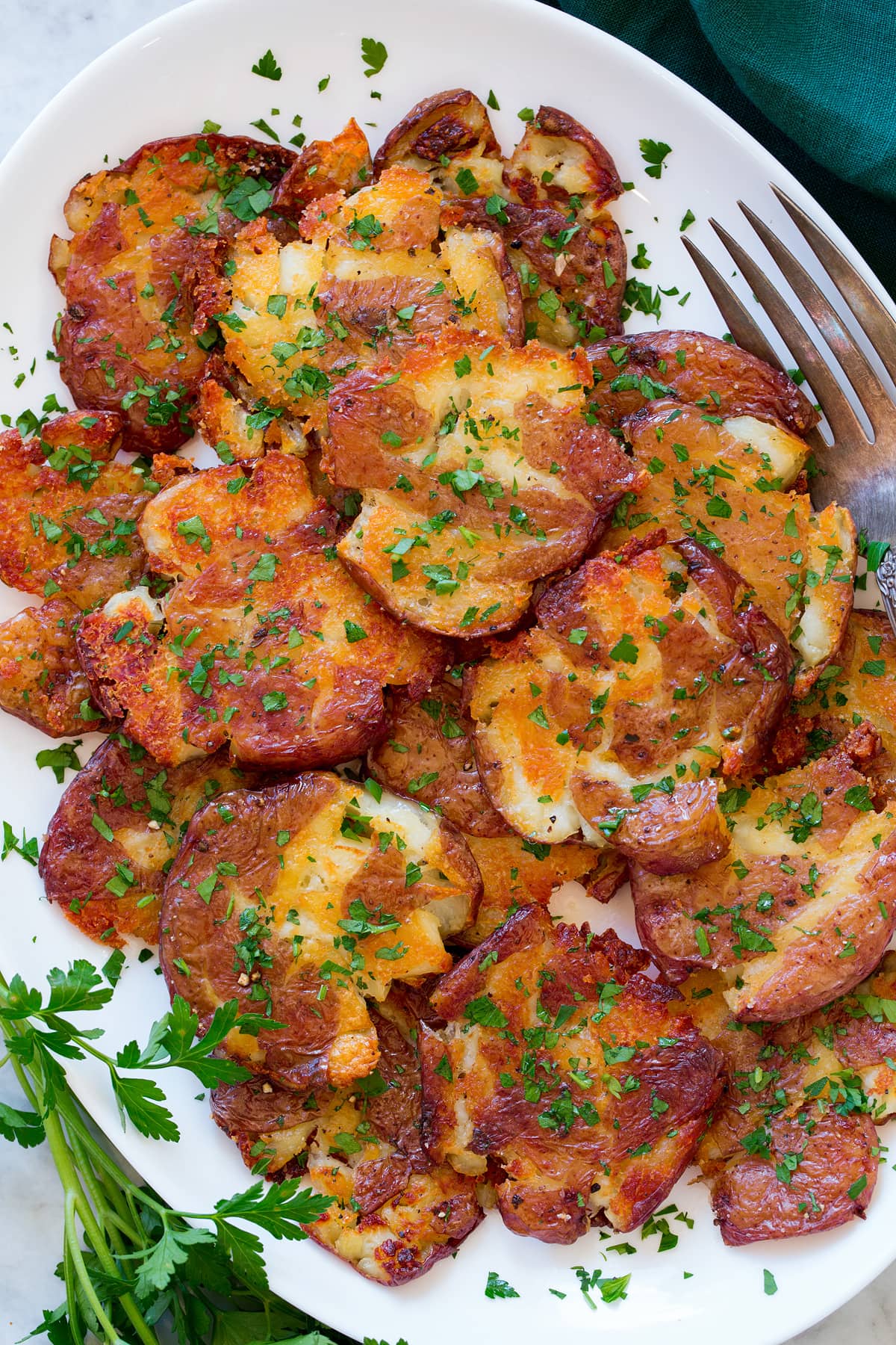 Close up photo showing crispy texture of smashed potatoes.