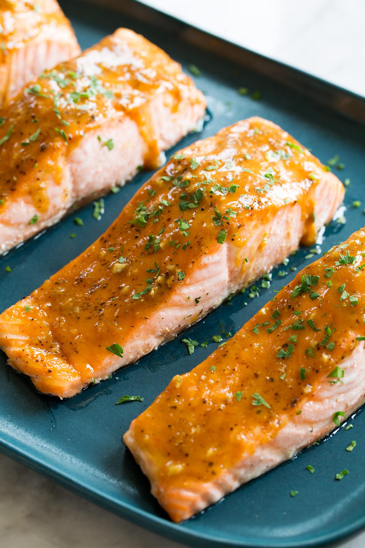 Close up photo of glazed baked salmon fillet.