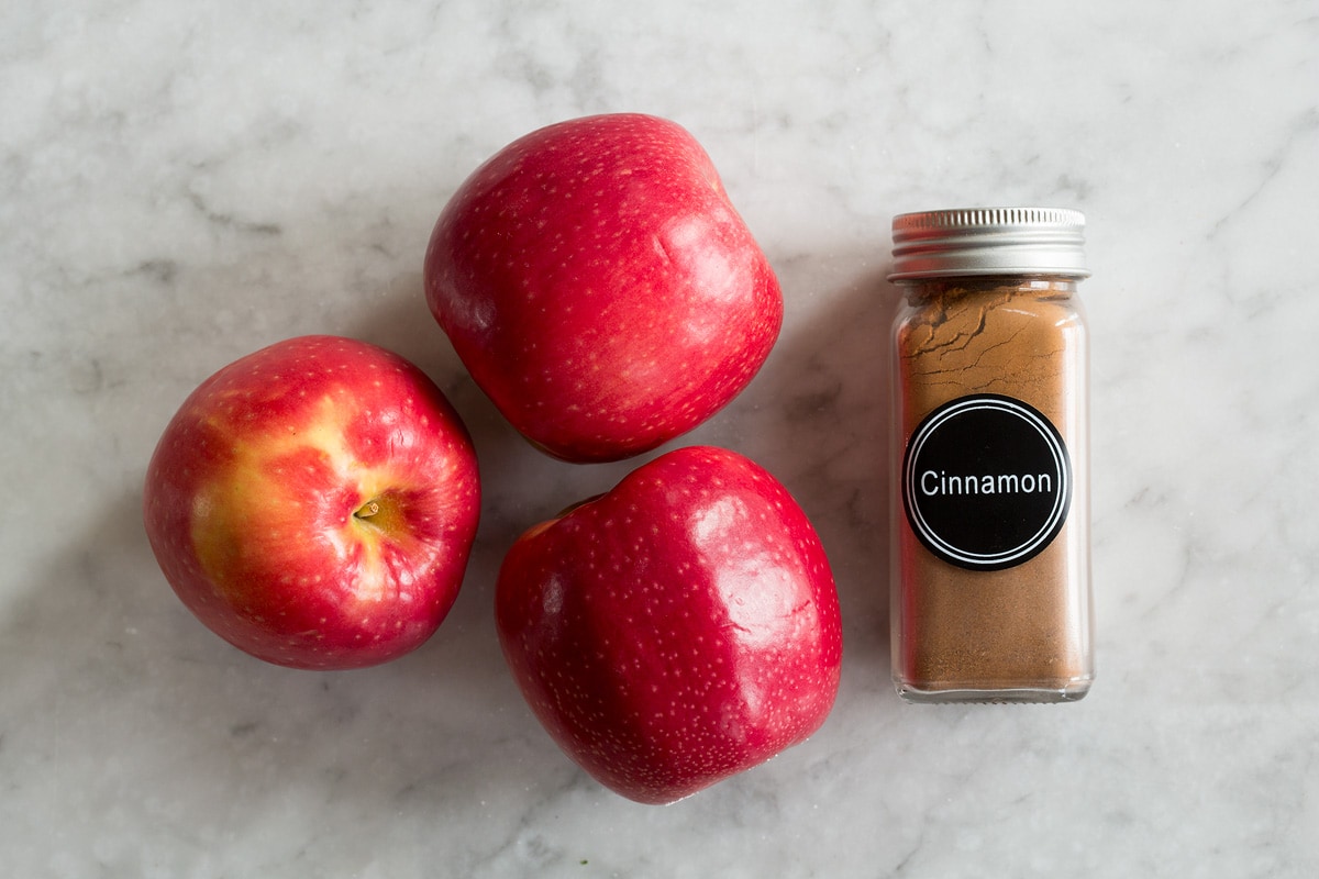 Photo of fresh apples and cinnamon - ingredients needed to make baked apple chips.