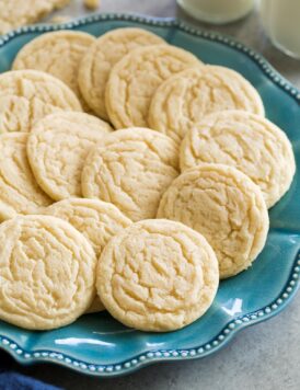 Classic homemade sugar cookies shown on a turquoise plate