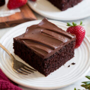 Slice of easy to make chocolate cake covered with a chocolate ganache frosting.