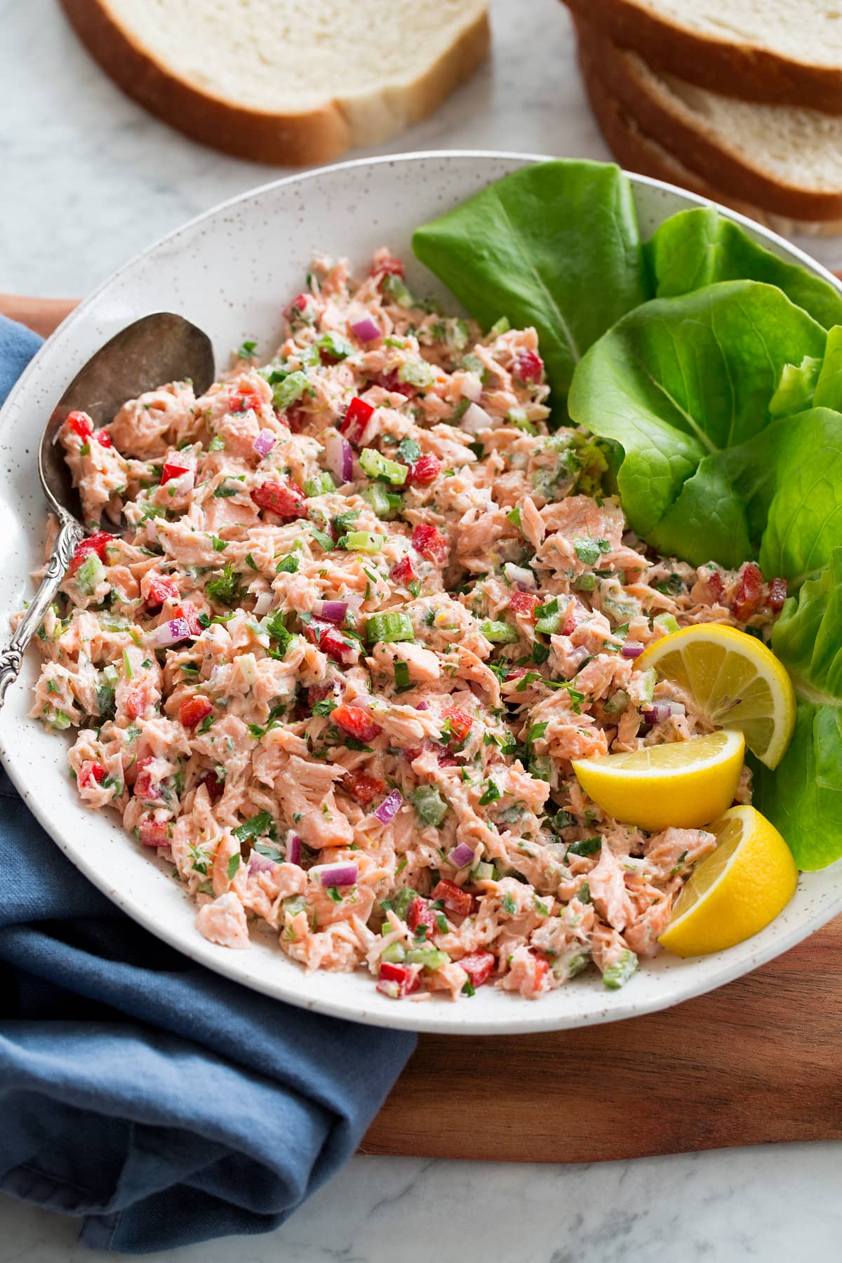 Salmon salad shown in a serving bowl from a side angle.