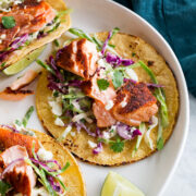 Close up photo of flaked seared salmon taco.