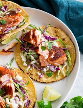 Close up photo of flaked seared salmon taco.