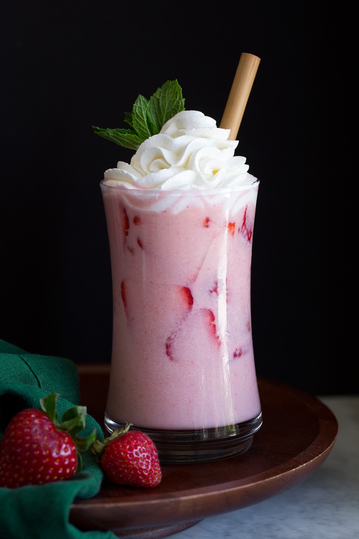 Pink drink with strawberry slices.