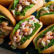 Shrimp salad in rolls with lettuce.