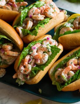 Shrimp salad in rolls with lettuce.