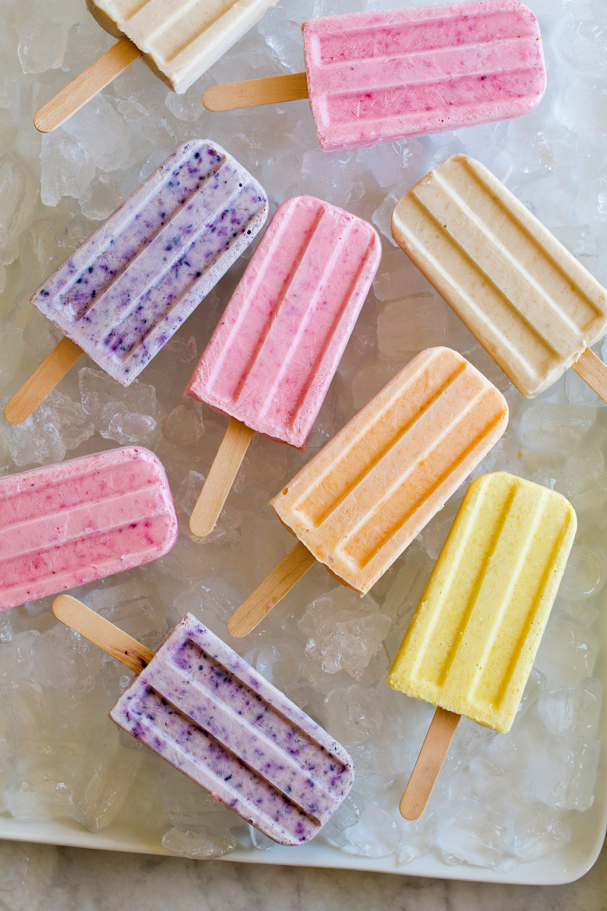 Close up photo of homemade yogurt popsicles in various flavors.