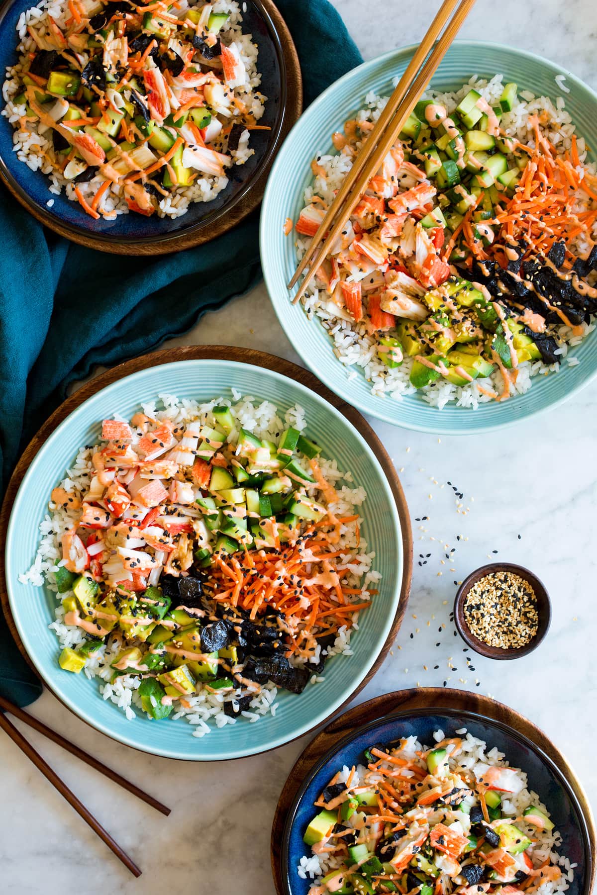 California Roll Bowls showing four servings in separate bowls with sushi rice.