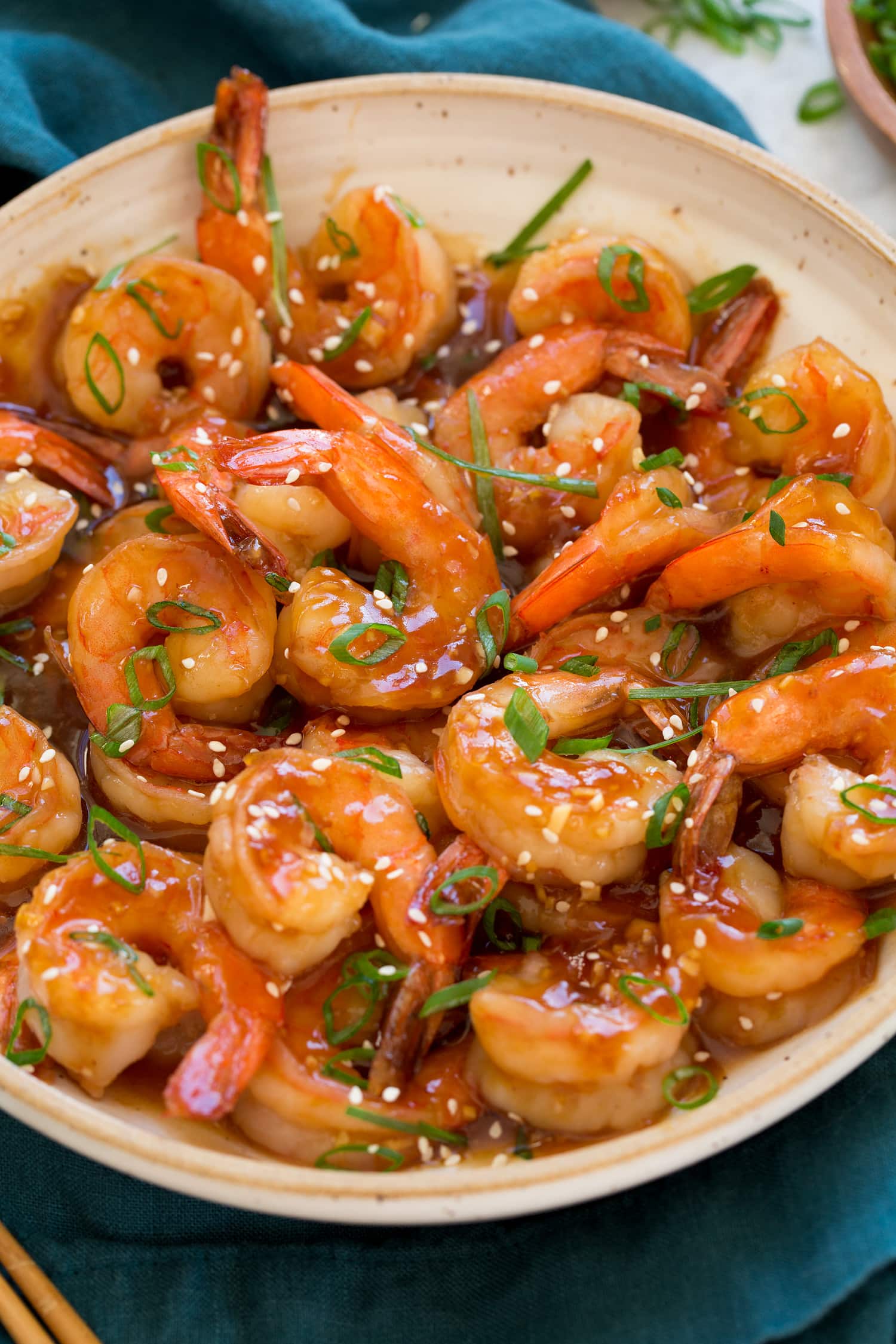 Close up image of ceramic bowl with homemade teriyaki shrimp.