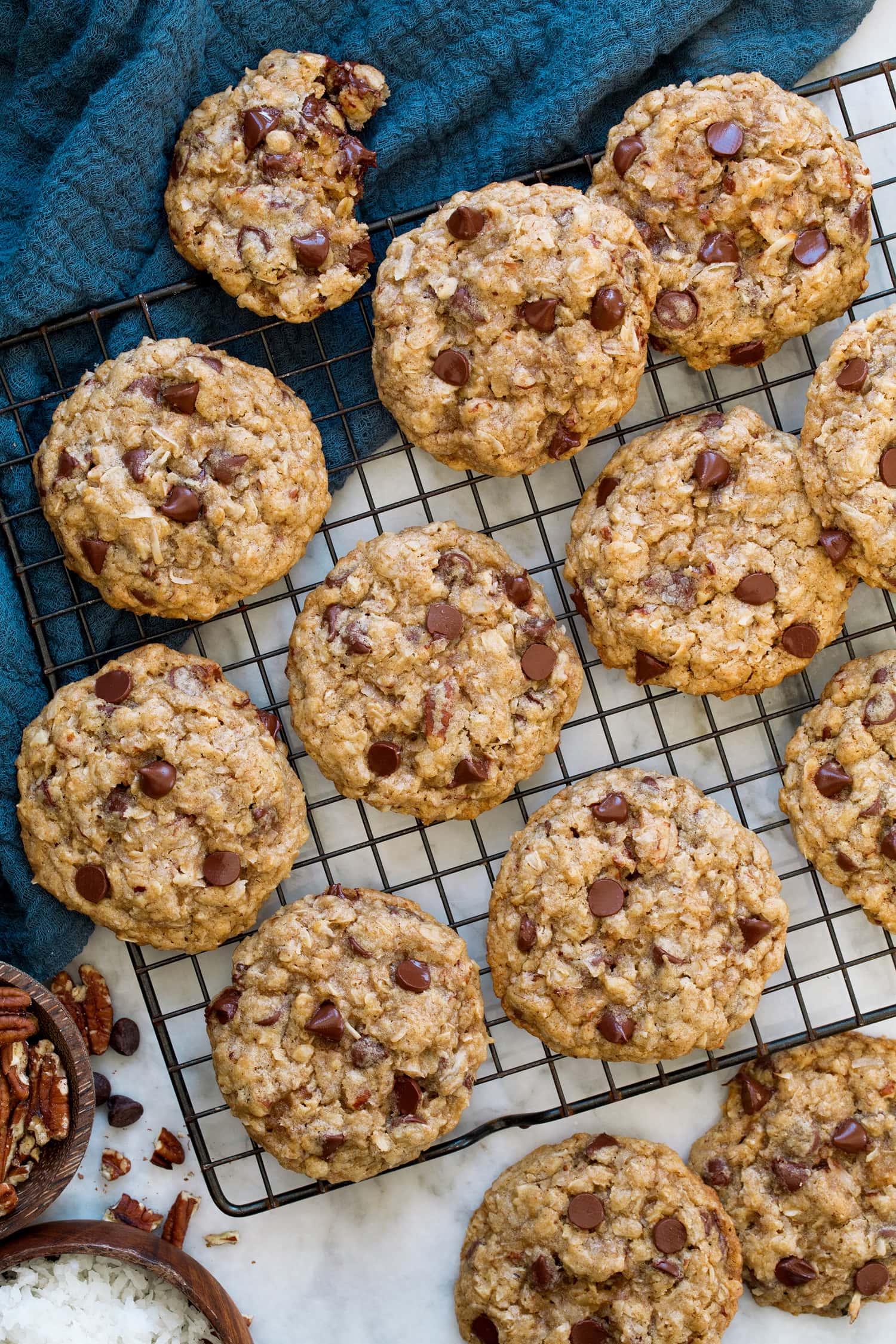 Homemade cowboy cookies shown on a cooling rack.