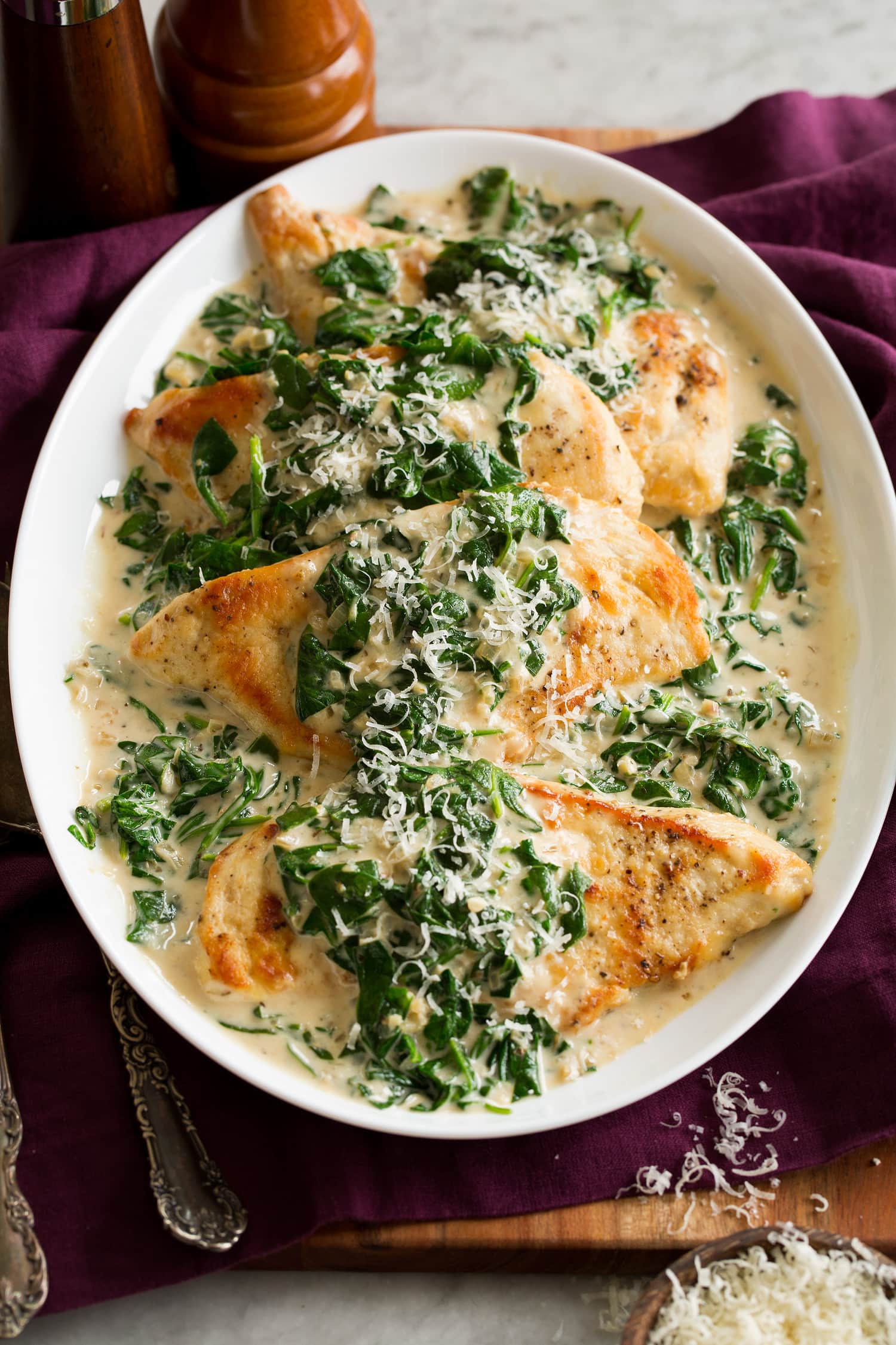 Pan seared chicken breasts with spinach sauce.