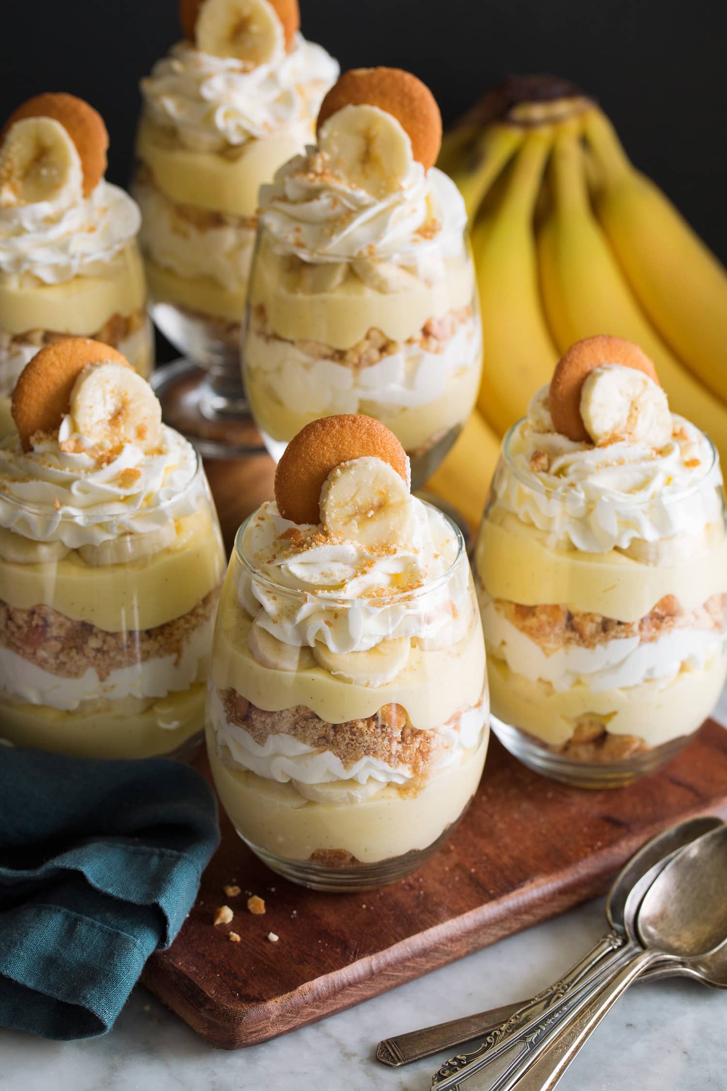 Glass cups of layered banana pudding.