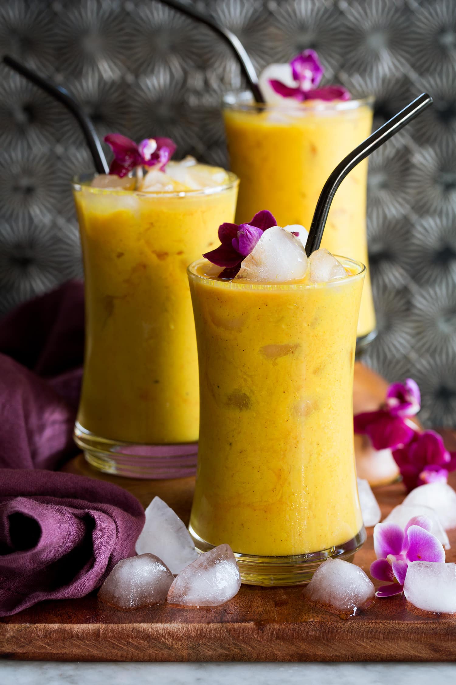 Iced golden milk in tall glasses.