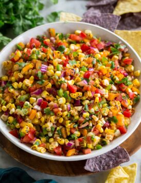 Corn salsa with corn, tomatoes, bell pepper, cilantro and onion.