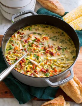 Chicken corn soup in a large grey pot.