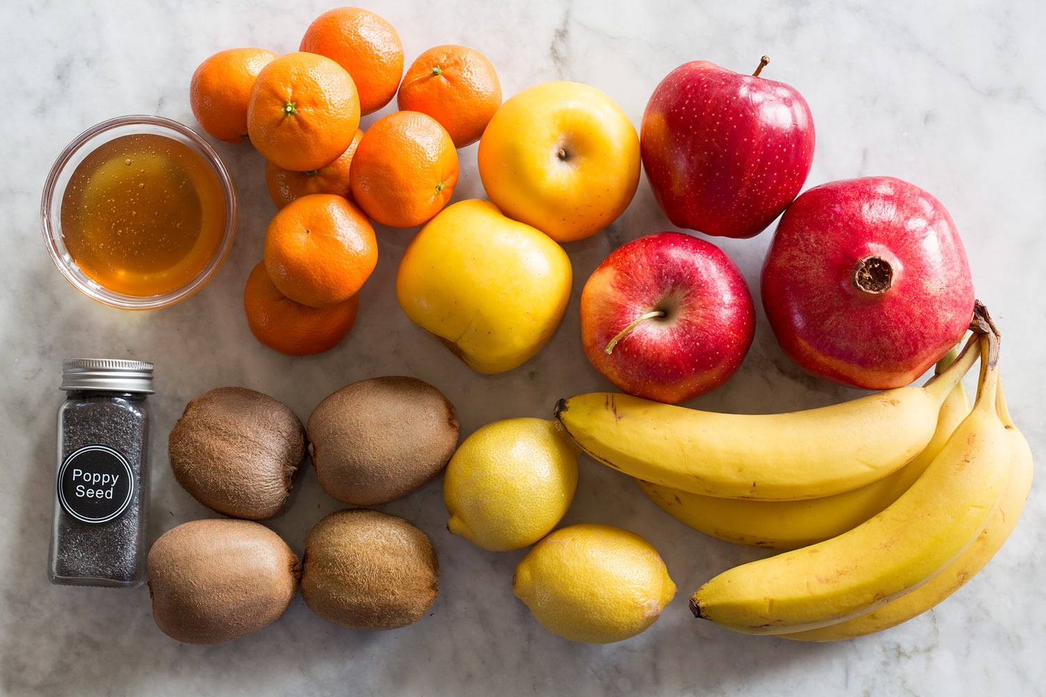 Whole ingredients needed for winter fruit salad.