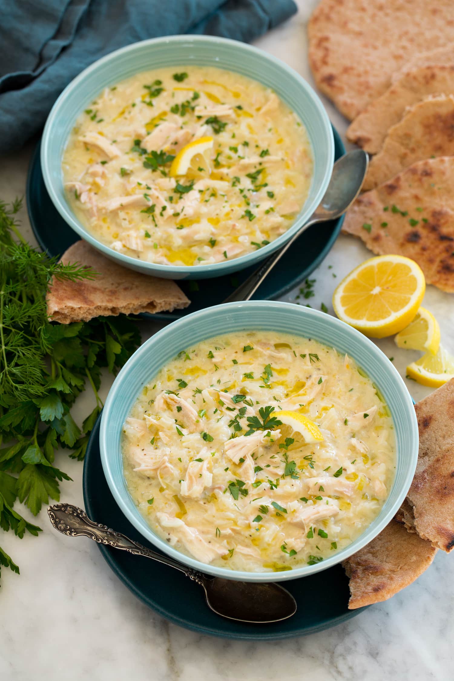 Greek lemon chicken soup served with pita bread.