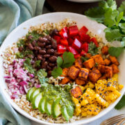 Baja grain bowl with black beans, tomatoes, sweet potatoes (or chicken), corn, avocado, red onion, brown rice and quinoa.